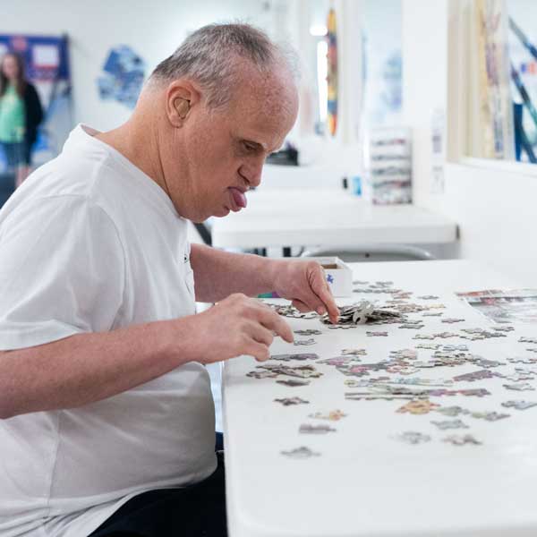 AFI client doing a puzzle
